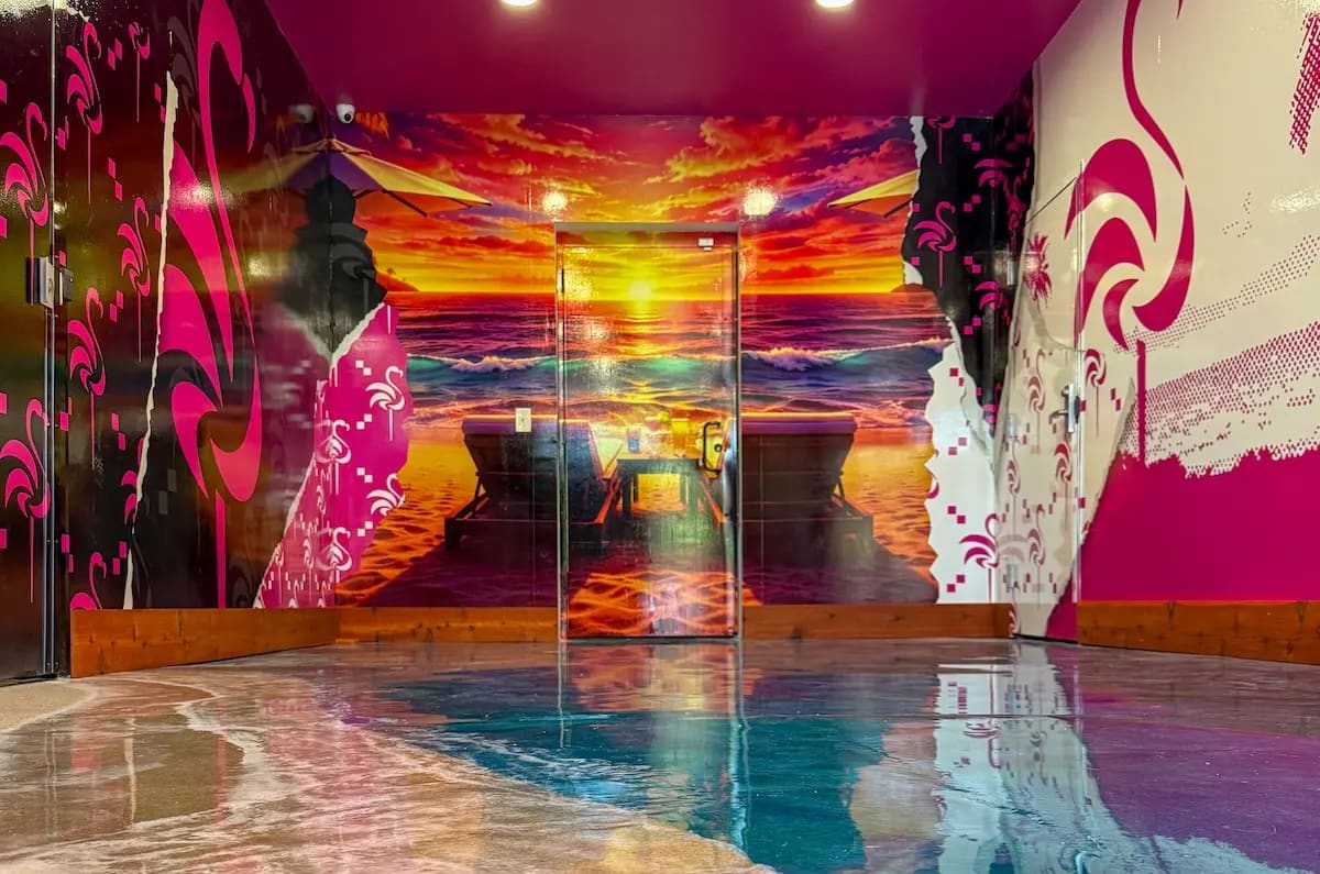 Waiting room: sunset mural, pink swirls, epoxy water floor